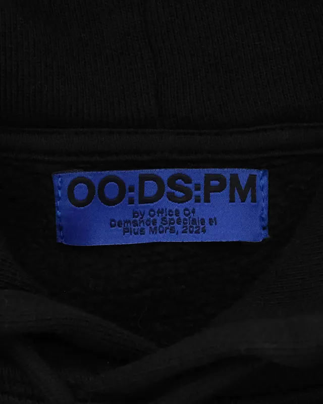 Branded label on textile product, photographic, minimal, dark