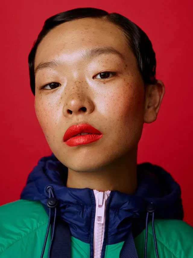 Portrait with bold color blocking, photographic, playful, vibrant