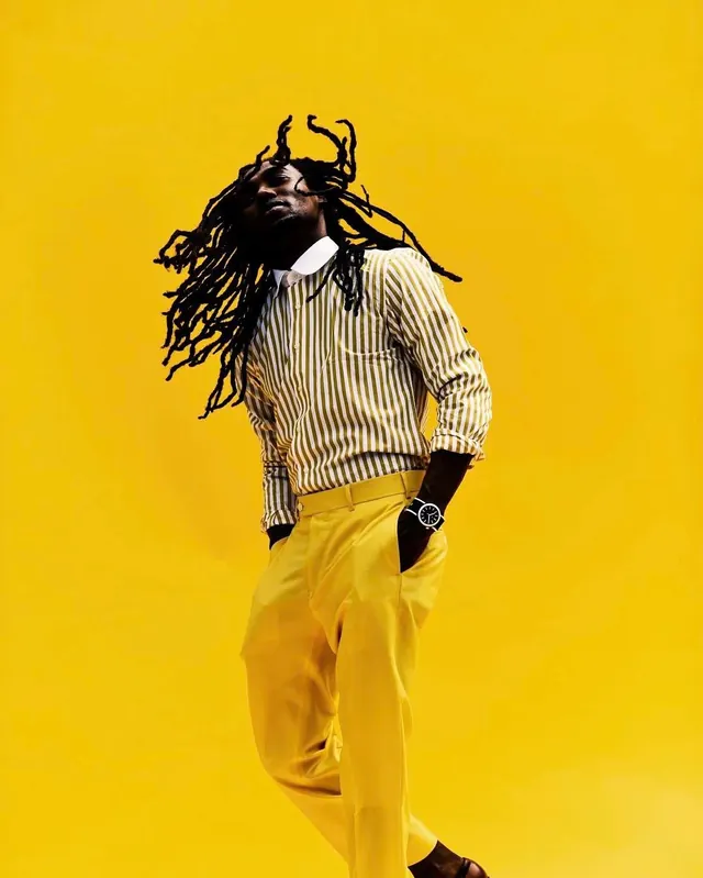 Portrait with textured hair and bold yellow background, photographic, bold, vibrant
