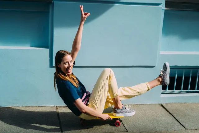 Skateboard fashion street style pose, photographic, playful, cool