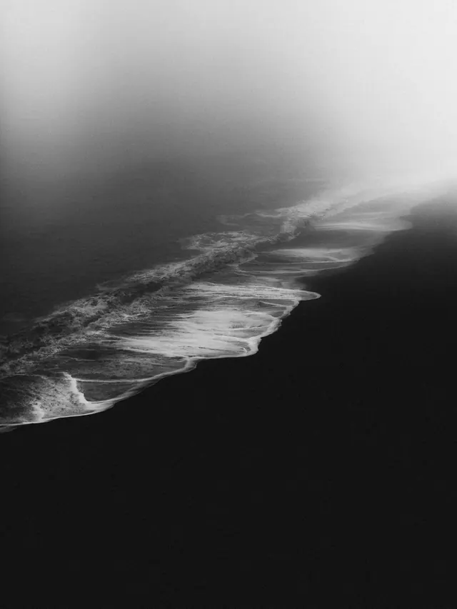 Dramatic coastal waves in black and white, photographic, monochrome, dark