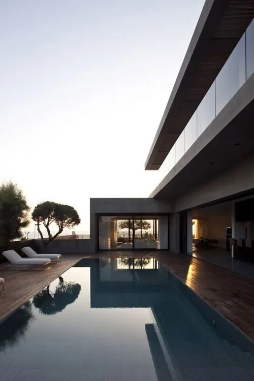 Minimalist modern pool house at dusk, photographic, minimal, light