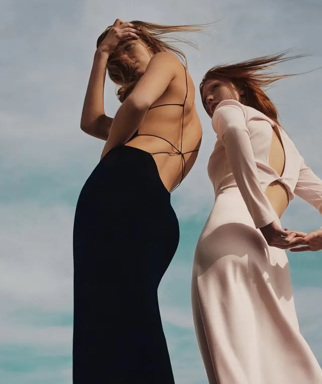 Two figures against sky fashion photography, photographic, editorial, warm