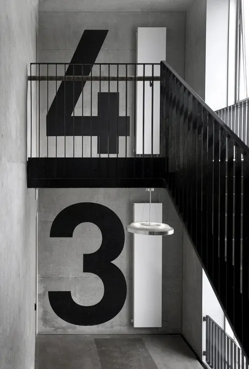 Stairwell numbers 4 and 3, minimal, technical, dark
