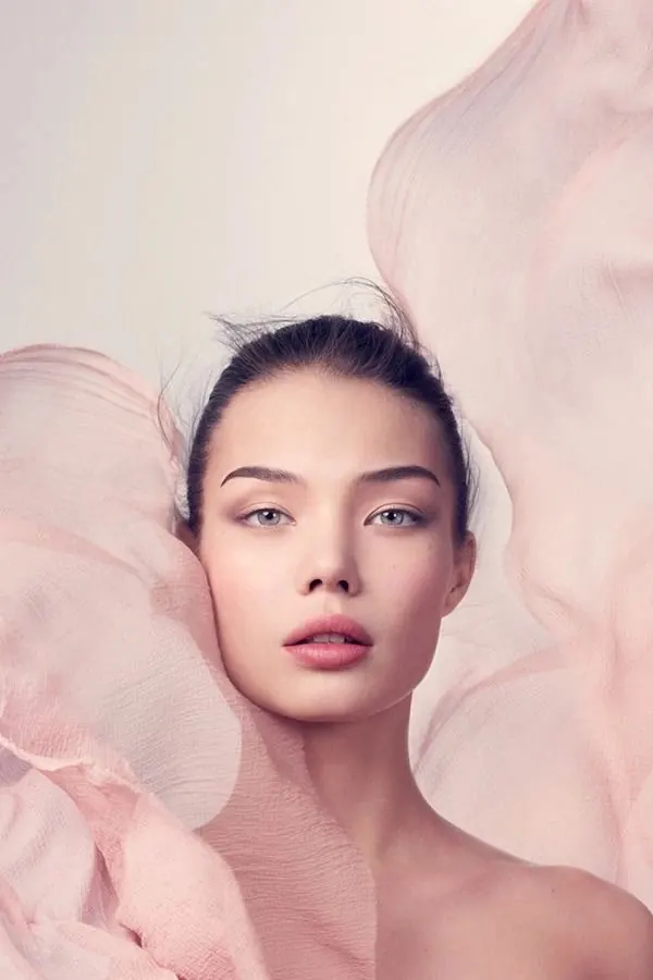 Portrait with soft pink fabric backdrop, photographic, illustrative, light