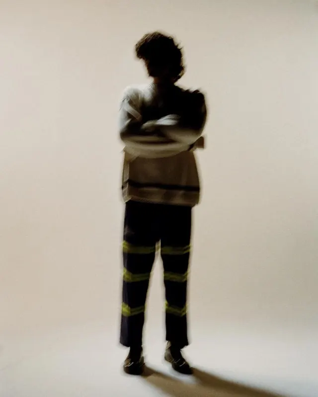 Figure portrait with motion blur and silhouette, photographic, organic, warm