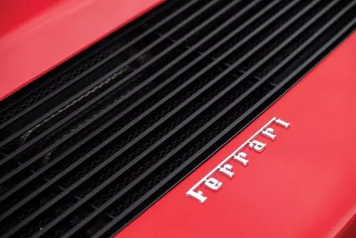 Ferrari hood vent detail, photographic, minimal, vibrant