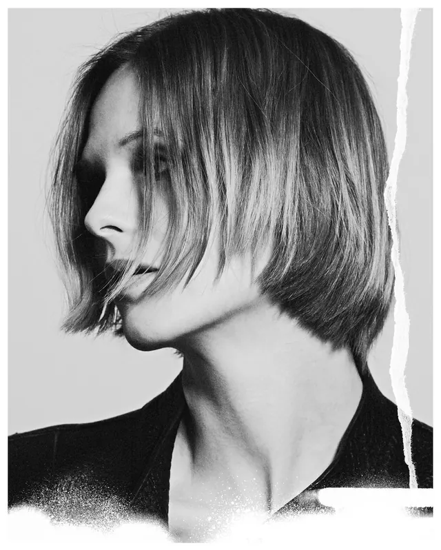 Black and white portrait with torn paper edge, photographic, editorial, monochrome
