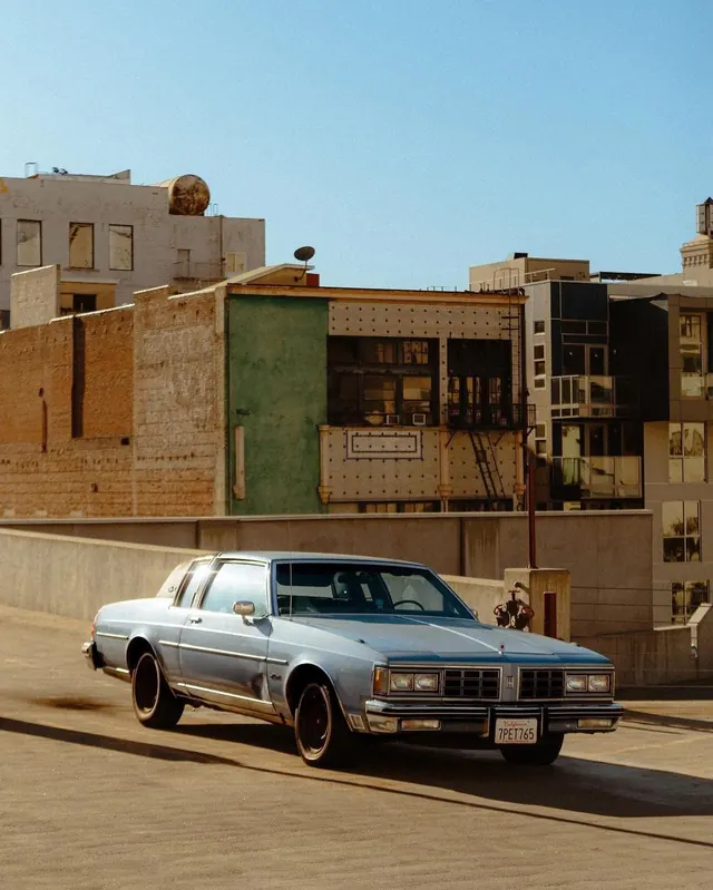 Urban street car and architecture, photographic, editorial, warm