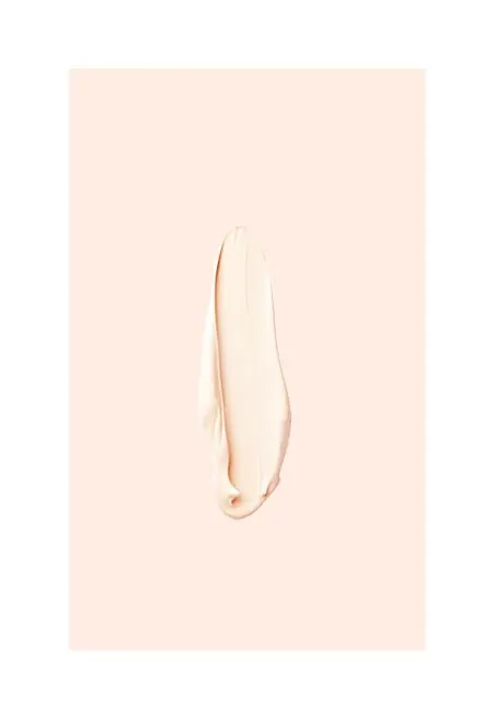 Minimalist pale bean-shaped object on beige background, minimal, light-mode, light