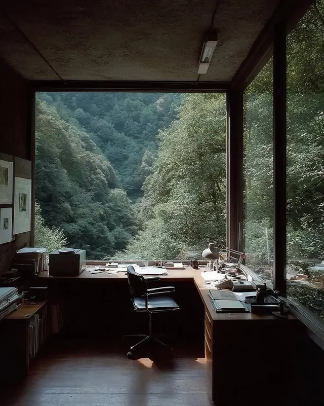 Modern office workspace with forest view, minimal, corporate-clean, dark