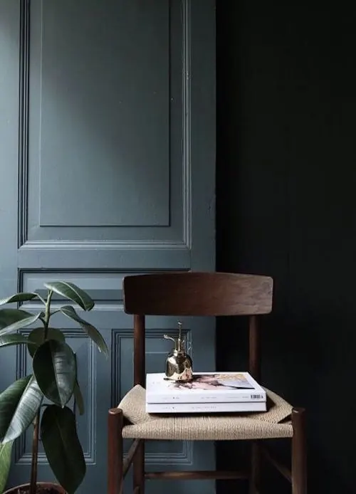 Minimalist interior with wood chair and plant, minimal, corporate-clean, dark