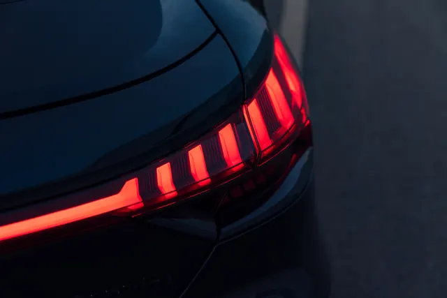 Automotive taillight detail, photographic, technical, dark