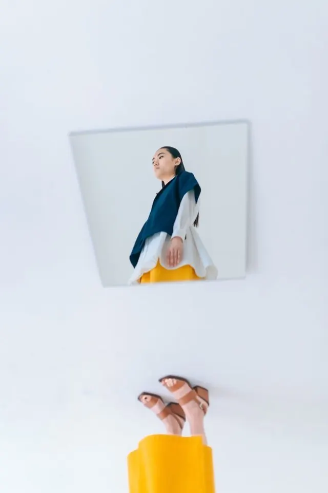 Playful double-exposure portrait with mirror and props, playful, illustrated, light