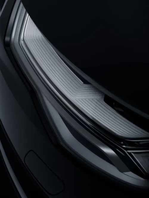 Car headlight detail, technical, photographic, dark