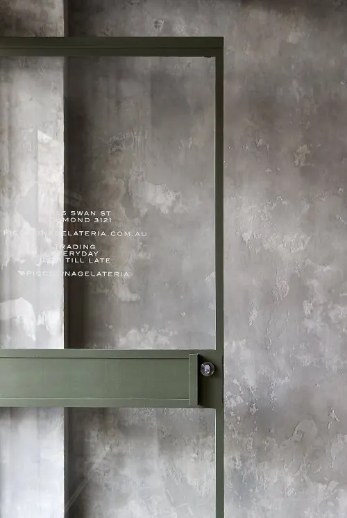 Minimal storefront with olive frame and text, minimal, brutalist, monochrome