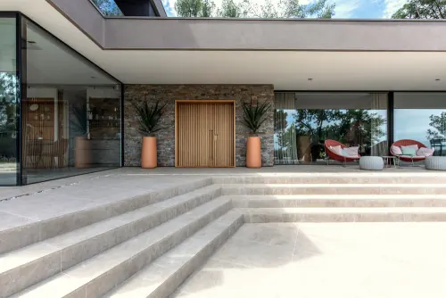 Modern minimalist residential entryway with stepped plaza, minimal, corporate-clean, light
