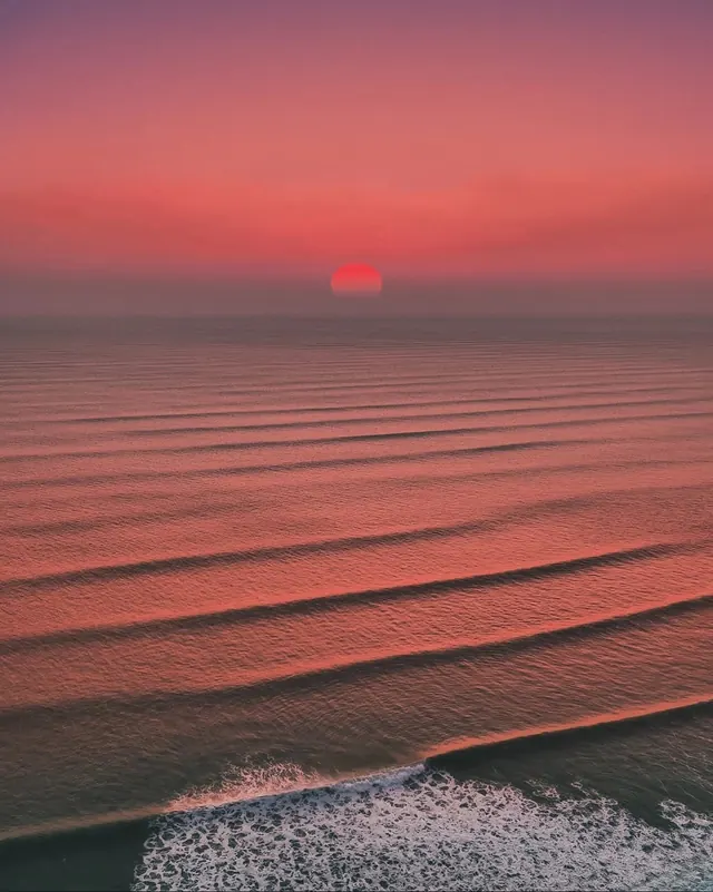 Sunset ocean horizon photograph, photographic, gradient-heavy, warm