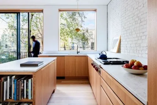 Modern minimalist kitchen with wood cabinetry and city view, minimal, corporate-clean, light