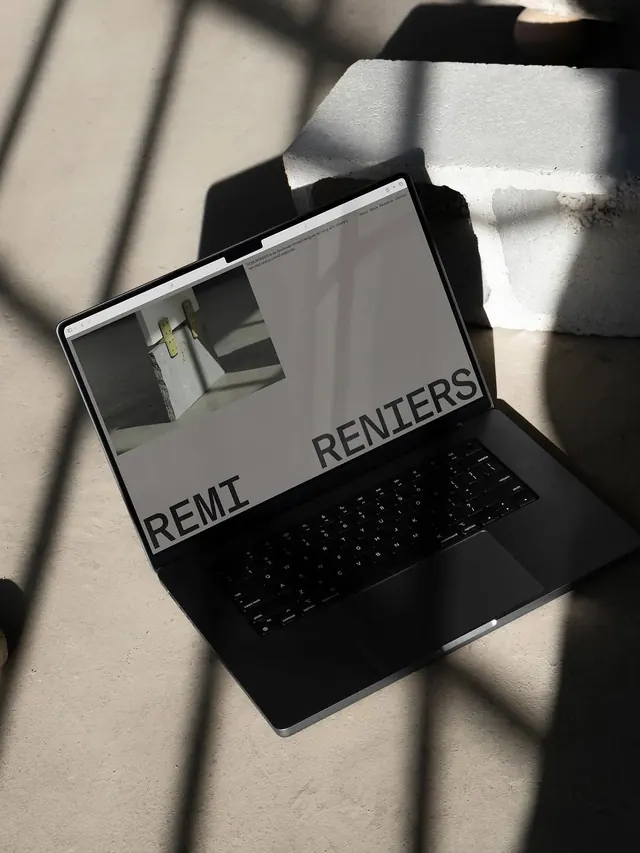Laptop displaying design publication mockup, minimal, technical, light