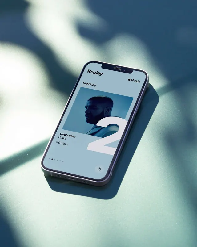 Apple Music Replay interface mockup with Drake card, minimal, light-mode, light