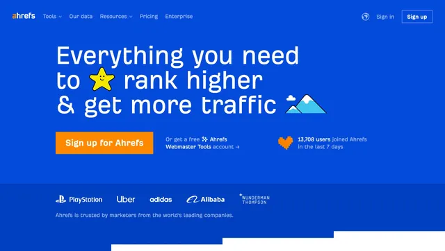 Ahrefs blue hero with logo bar, minimal, light-mode, vibrant