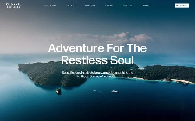 Kudanil Explorer aerial island hero, minimal, luxury, dark