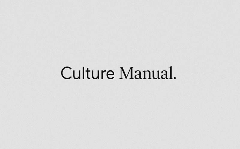 Centered serif identity with period punctuation, minimal, editorial, dark